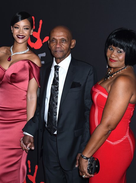 Rihanna with her mother and grandfather